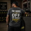 First responder t-shirt featuring The Badge Comes Off The Mindset Doesn't slogan worn by firefighter in fire station